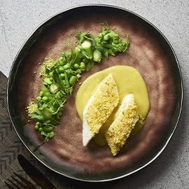 Baked Chilean Sea Bass and Coconut Herb Crust with Green Salad and S.E.A. Spice Veloute	