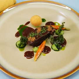 Braised Beef Cheek with Yellow Mustard Jus, Glazed Baby Carrots and Crispy Kale