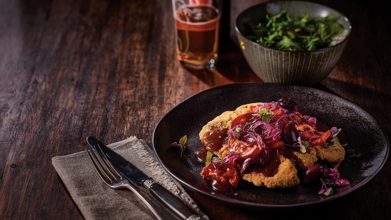 Lamb Cutlet Schnitzel With Grilled Tomatoes Olives, and Onion Jam Gravy – - Recipe